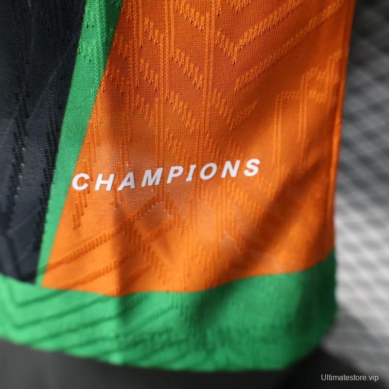 Player Version 2025 Ivory Coast Black with Elephant Graphic and Orange Stripes Jersey
